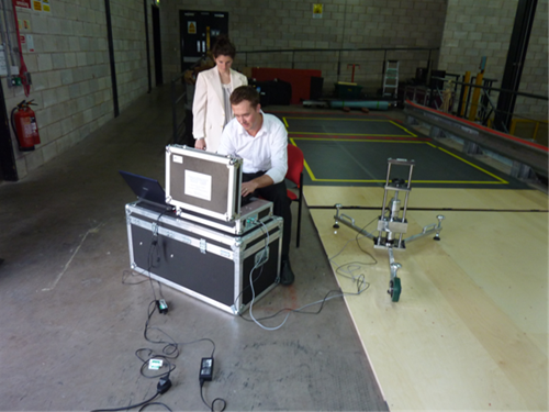 Luke Hopper and Talia Wheeler assessing a floor